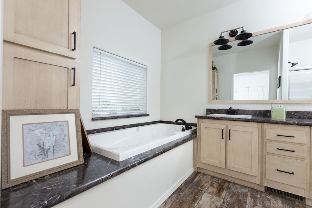 The 2848 MARLETTE SPECIAL Primary Bathroom. This Manufactured Mobile Home features 3 bedrooms and 2 baths.