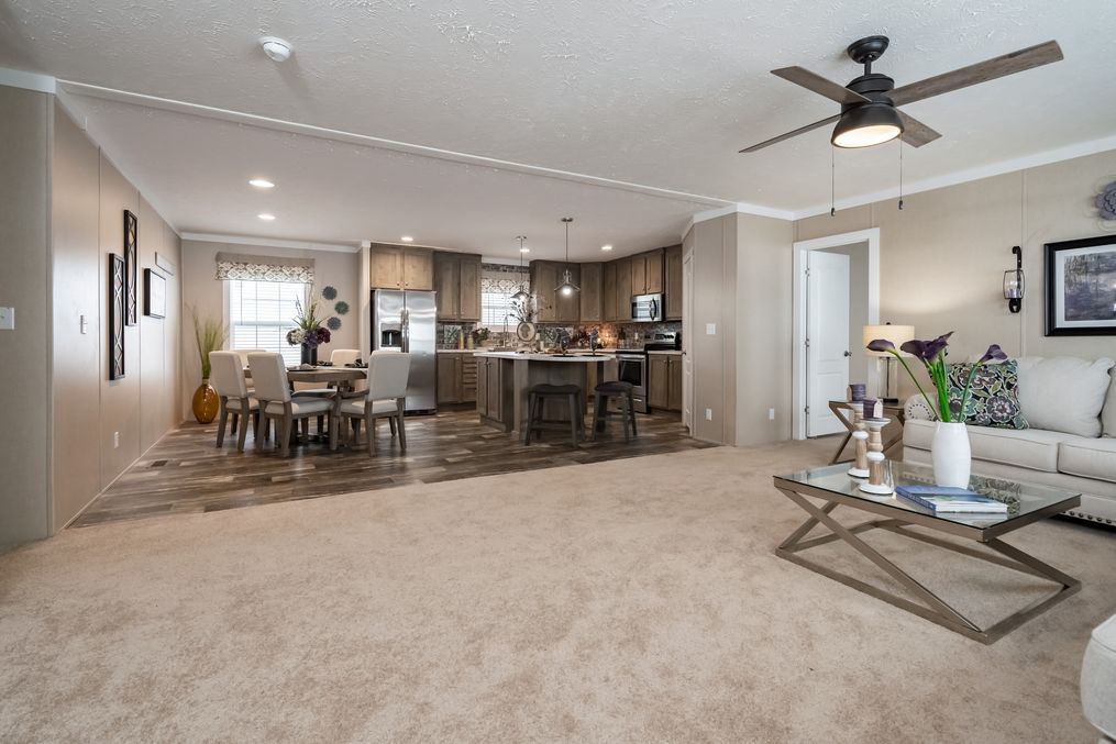 The ELITE COMMANDER 32X76 4 BR Living Room. This Manufactured Mobile Home features 4 bedrooms and 2 baths.