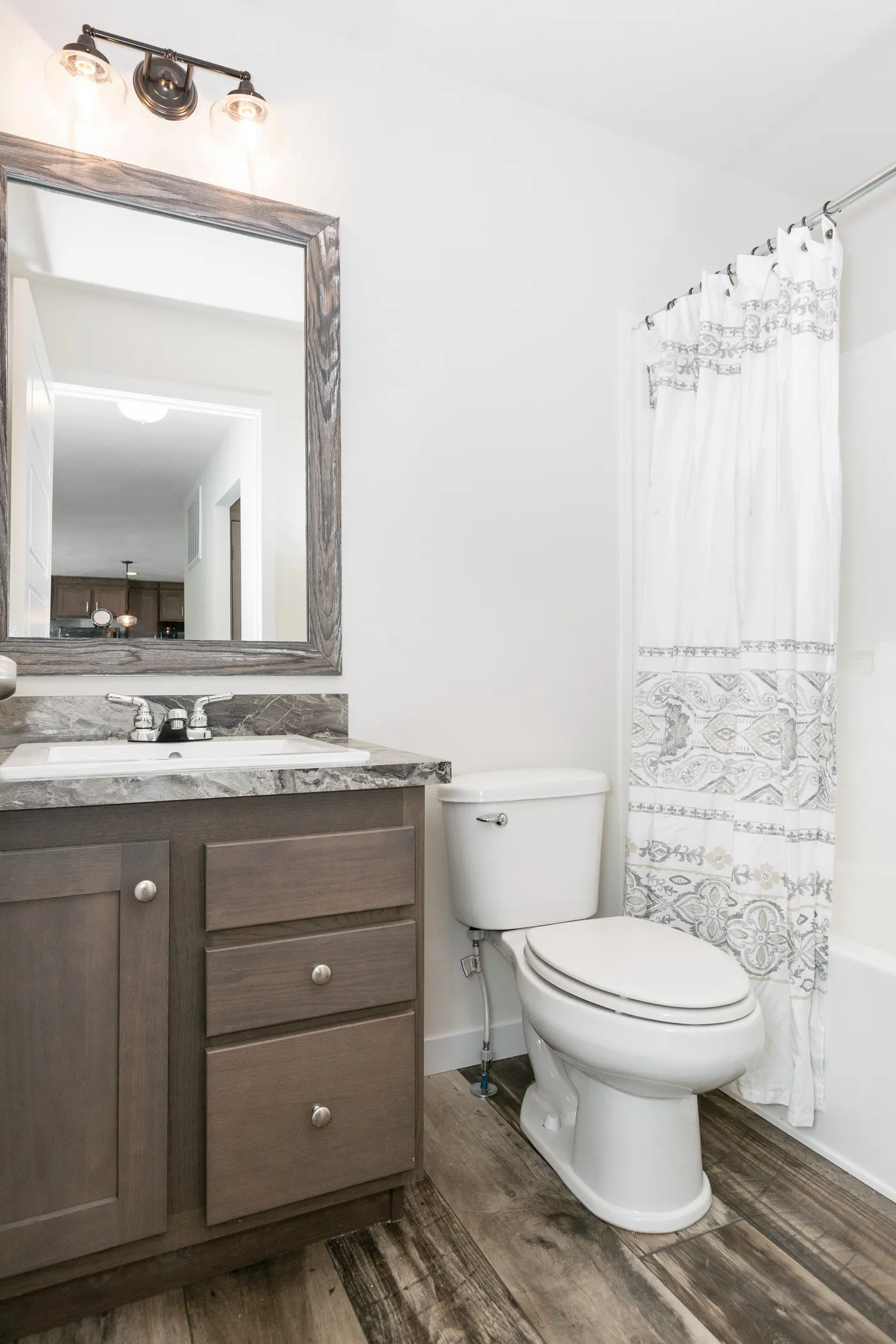 The SOMERSET DR 5228-MS012 SECT Guest Bathroom. This Manufactured Mobile Home features 3 bedrooms and 2 baths.