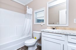 The THE HOGAN 28 Guest Bathroom. This Manufactured Mobile Home features 3 bedrooms and 2 baths.