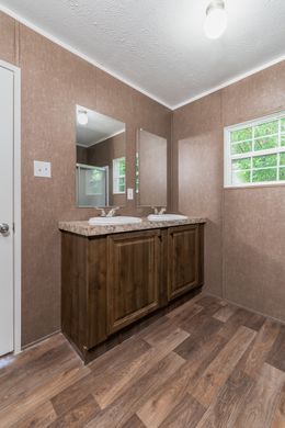 The TRADITION 3268B Master Bathroom. This Manufactured Mobile Home features 5 bedrooms and 3 baths.