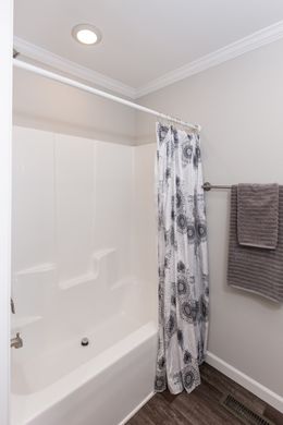 The THE FREEDOM GRAND 4BR 32X62 Guest Bathroom. This Manufactured Mobile Home features 4 bedrooms and 2 baths.