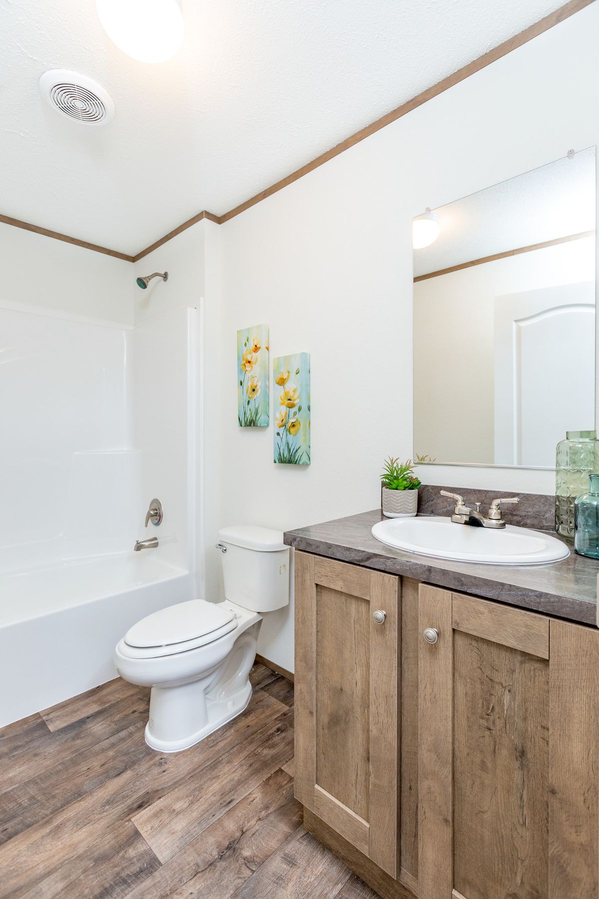 The LIFESTYLE 211 Guest Bathroom. This Manufactured Mobile Home features 3 bedrooms and 2 baths.