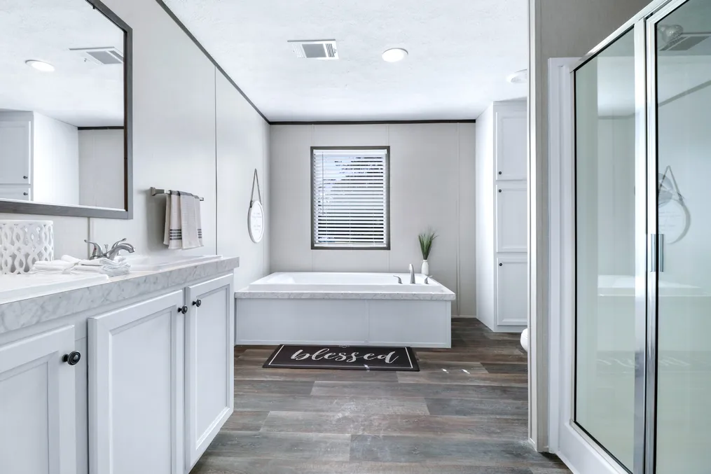 The ABSOLUTE VALUE Primary Bathroom. This Manufactured Mobile Home features 4 bedrooms and 2 baths.