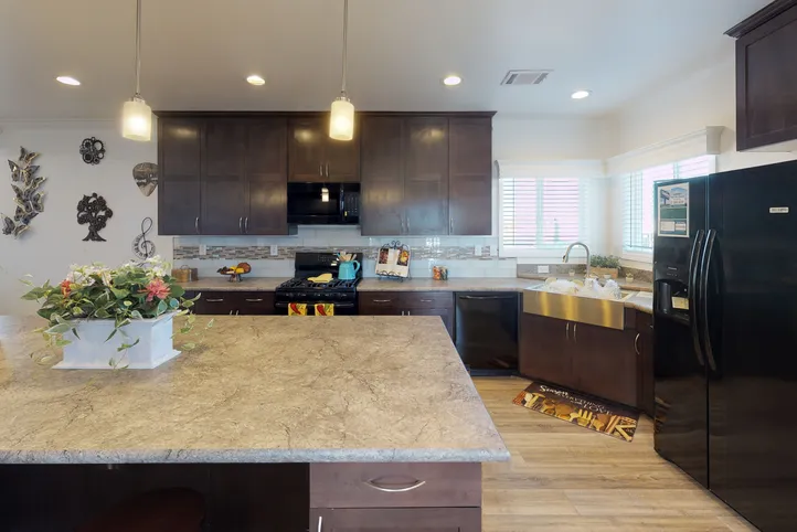 The SUM3068A Kitchen. This Manufactured Mobile Home features 3 bedrooms and 2 baths.