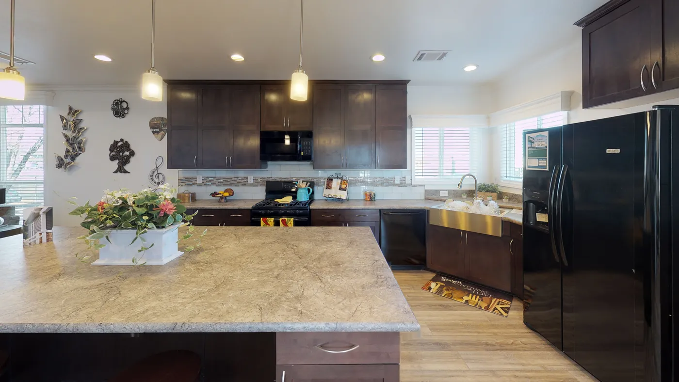 The SUM3068A Kitchen. This Manufactured Mobile Home features 3 bedrooms and 2 baths.