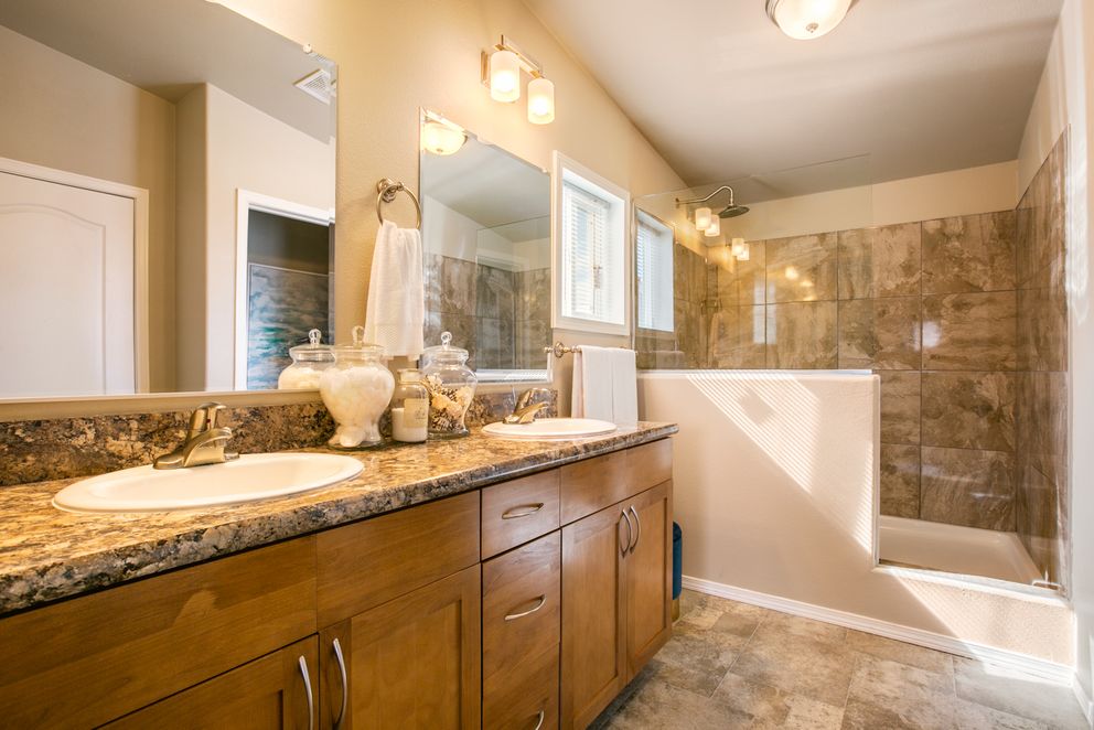 The THE WAVE Primary Bathroom. This Manufactured Mobile Home features 4 bedrooms and 2 baths.