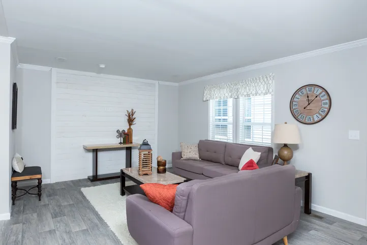 The THE FREEDOM BREEZE Living Room. This Manufactured Mobile Home features 3 bedrooms and 2 baths.