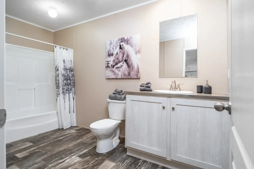 The ULTRA PRO 56B Guest Bathroom. This Manufactured Mobile Home features 3 bedrooms and 2 baths.