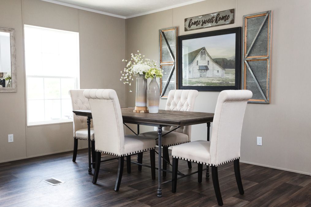 The ISLAND BREEZE Dining Area. This Manufactured Mobile Home features 3 bedrooms and 2 baths.