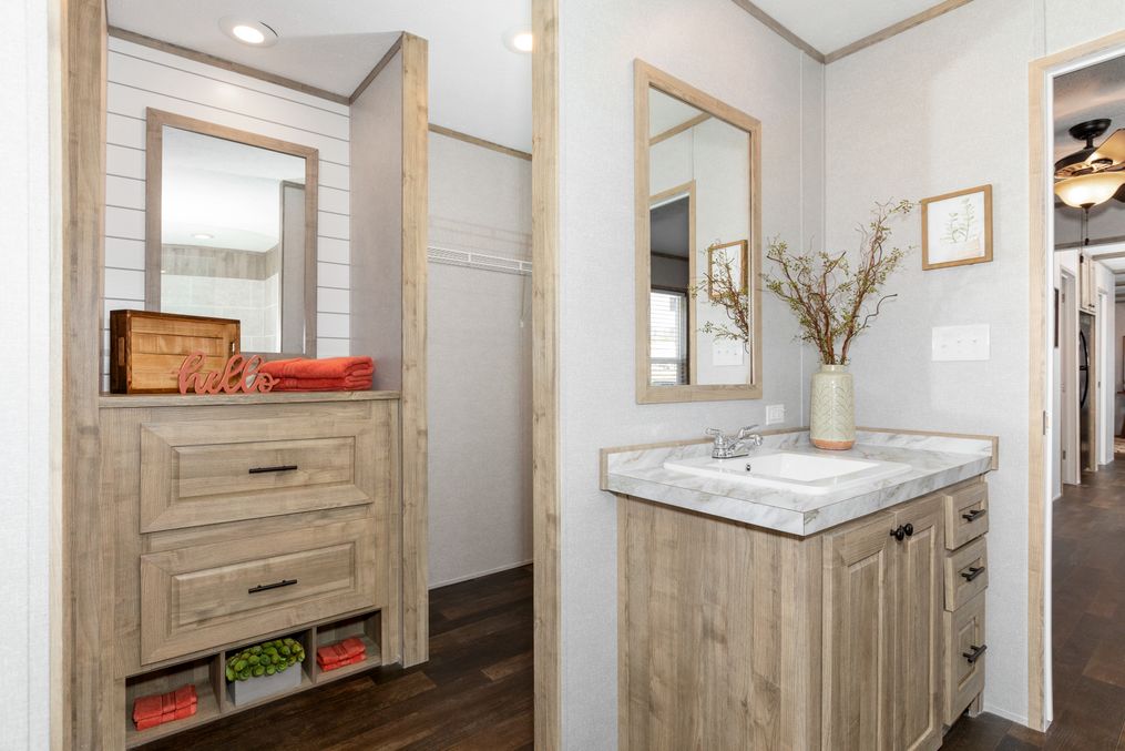 The THE 1959 Primary Bathroom. This Manufactured Mobile Home features 3 bedrooms and 2 baths.