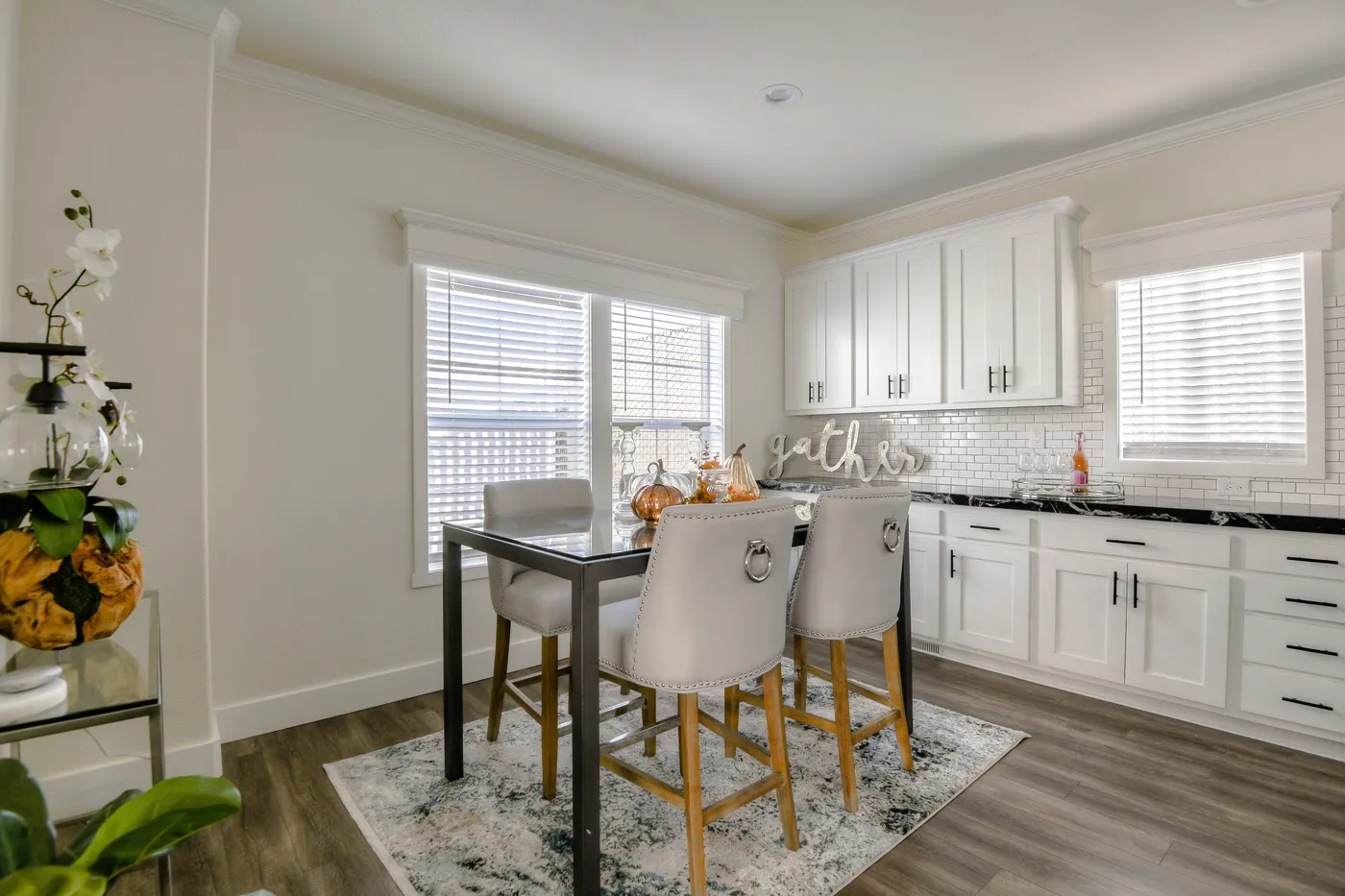 The CORONADO 2458F Dining Area. This Manufactured Mobile Home features 3 bedrooms and 3 baths.