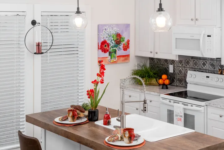 The 1439 CAROLINA "MAGNOLIA" Kitchen. This Manufactured Mobile Home features 3 bedrooms and 2 baths.