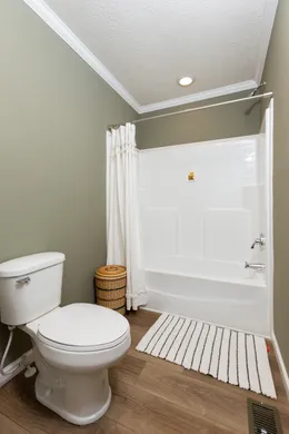 The KEENELAND Guest Bathroom. This Manufactured Mobile Home features 3 bedrooms and 2 baths.