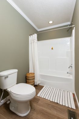 The KEENELAND Guest Bathroom. This Manufactured Mobile Home features 3 bedrooms and 2 baths.