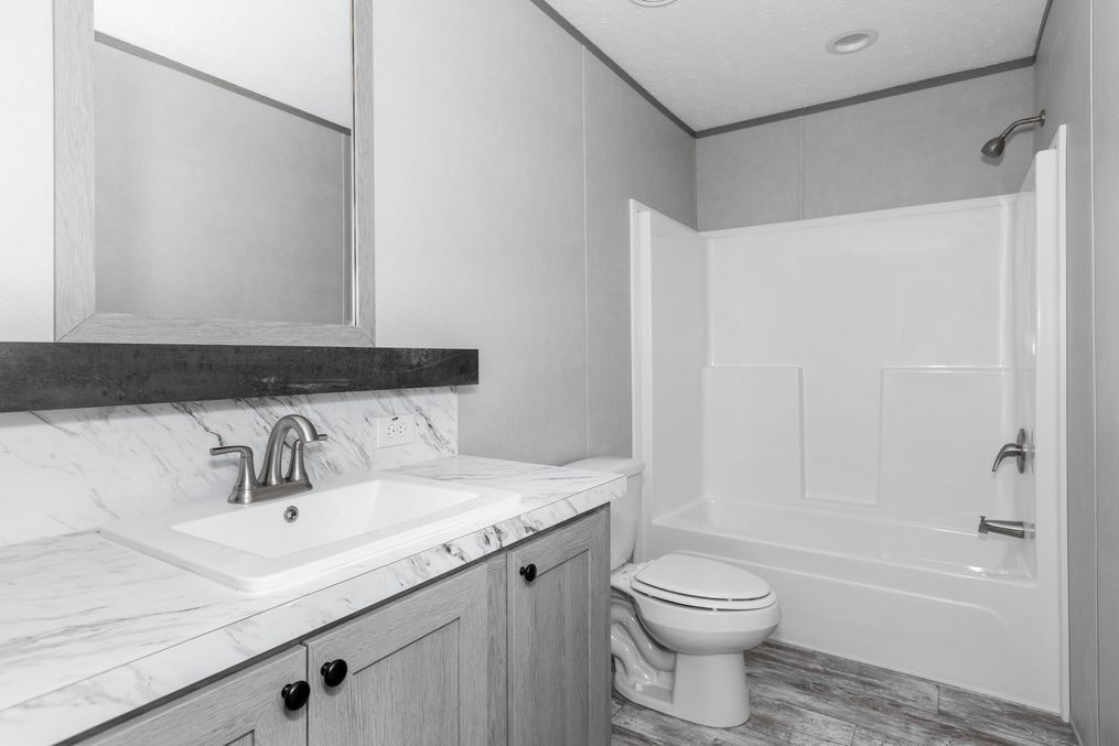 The DIAMOND Guest Bathroom. This Manufactured Mobile Home features 3 bedrooms and 2 baths.