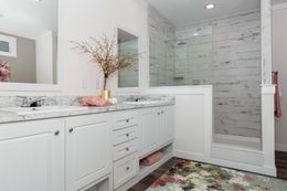 The 1439 CAROLINA "MAGNOLIA" Primary Bathroom. This Manufactured Mobile Home features 3 bedrooms and 2 baths.