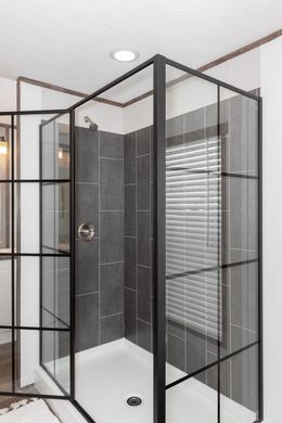 The PLATINUM ANNIVERSARY Primary Bathroom. This Manufactured Mobile Home features 3 bedrooms and 2 baths.