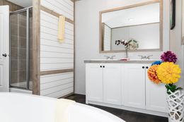 The FARM HOUSE BREEZE 72 Primary Bathroom. This Manufactured Mobile Home features 4 bedrooms and 2 baths.