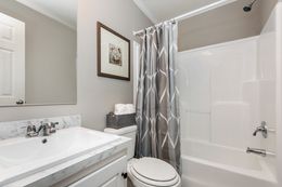 The 777 "COOL BREEZE" 7616 Guest Bathroom. This Manufactured Mobile Home features 3 bedrooms and 2 baths.