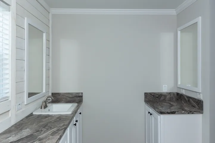 The THE FREEDOM BREEZE Primary Bathroom. This Manufactured Mobile Home features 3 bedrooms and 2 baths.
