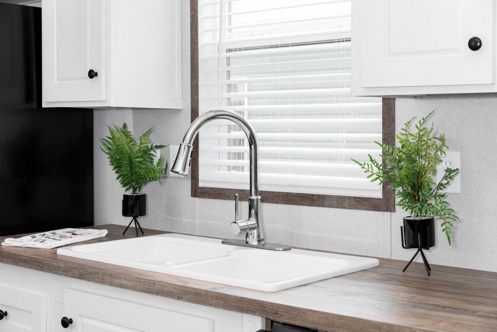 The BLAZER 76 P Kitchen. This Manufactured Mobile Home features 3 bedrooms and 2 baths.