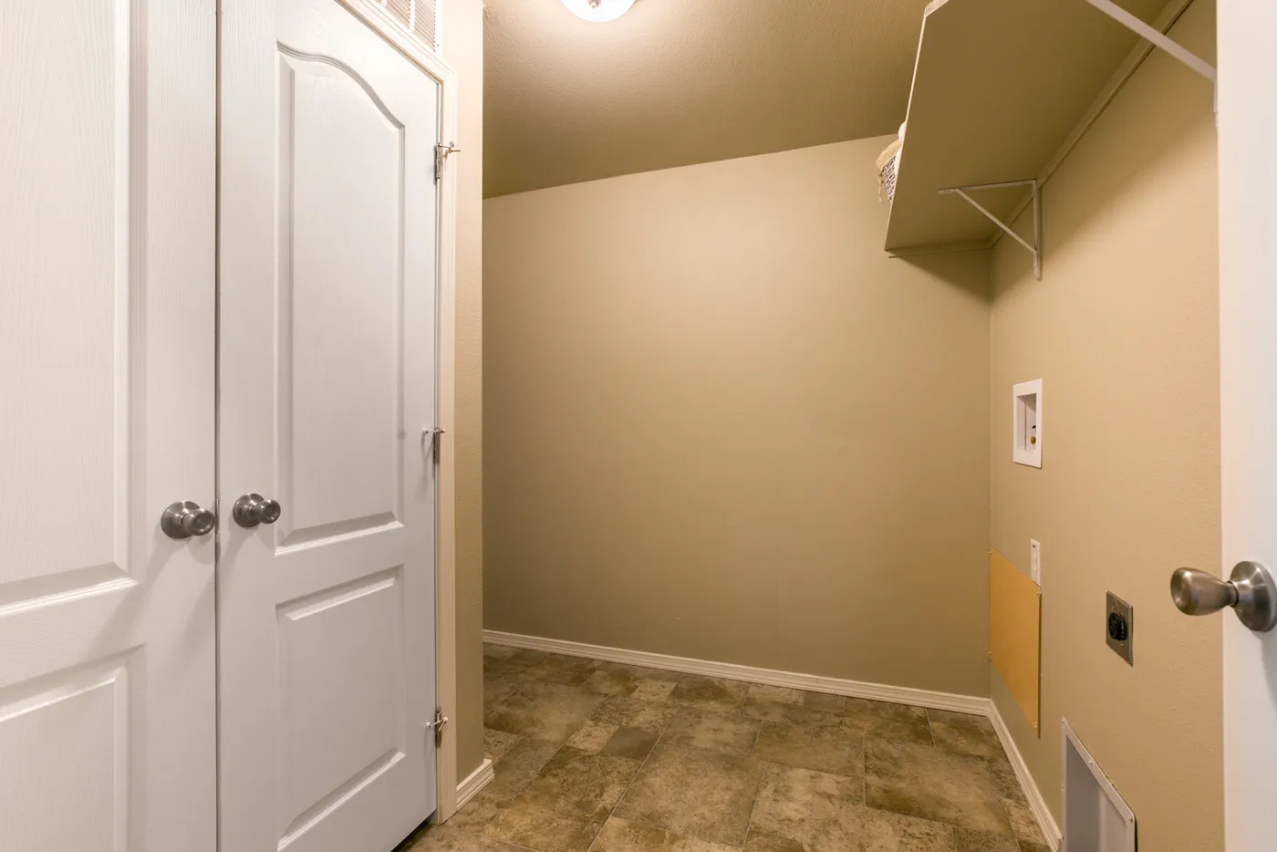 The THE WAVE Utility Room. This Manufactured Mobile Home features 4 bedrooms and 2 baths.