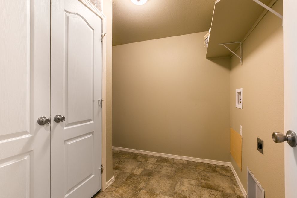 The THE WAVE Utility Room. This Manufactured Mobile Home features 4 bedrooms and 2 baths.