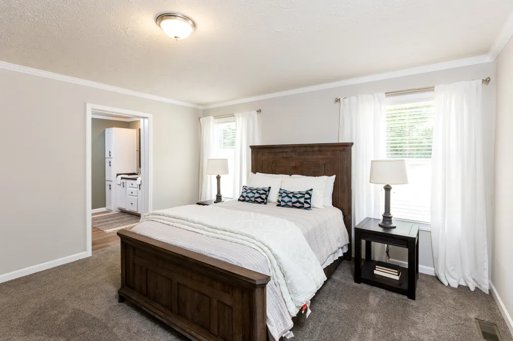 The KEENELAND Primary Bedroom. This Manufactured Mobile Home features 3 bedrooms and 2 baths.