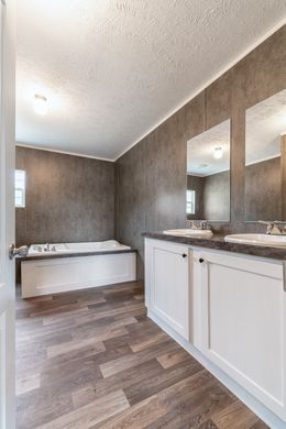 The TRADITION 56D Primary Bathroom. This Manufactured Mobile Home features 3 bedrooms and 2 baths.