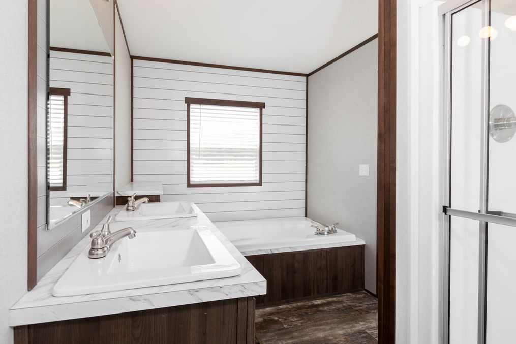 The THE POWERHOUSE Master Bathroom. This Manufactured Mobile Home features 3 bedrooms and 2 baths.