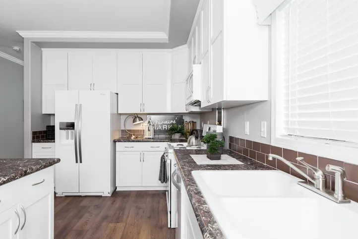 The ENCHANTMENT 3070A Kitchen. This Manufactured Mobile Home features 3 bedrooms and 2 baths.