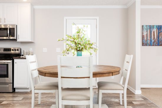 The SANTA FE 684A Dining Area. This Manufactured Mobile Home features 4 bedrooms and 2 baths.