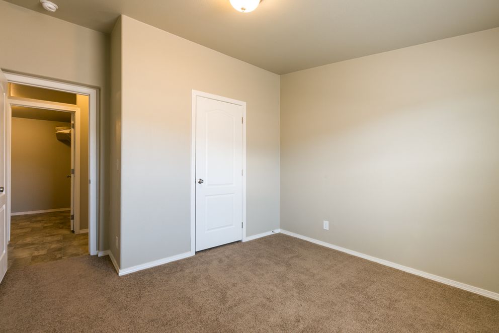 The THE WAVE Guest Bedroom. This Manufactured Mobile Home features 4 bedrooms and 2 baths.