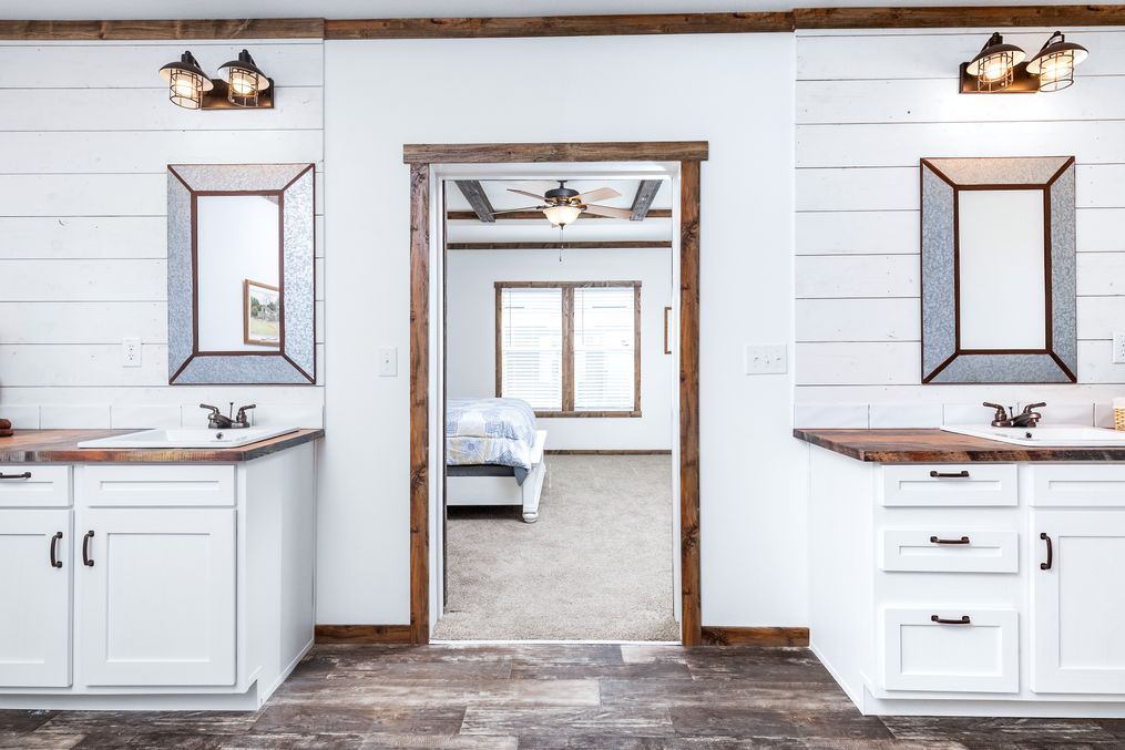 The THE BRAZOS Primary Bathroom. This Manufactured Mobile Home features 3 bedrooms and 2.5 baths.