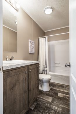 The ULTRA PRO 52 Guest Bathroom. This Manufactured Mobile Home features 3 bedrooms and 2 baths.