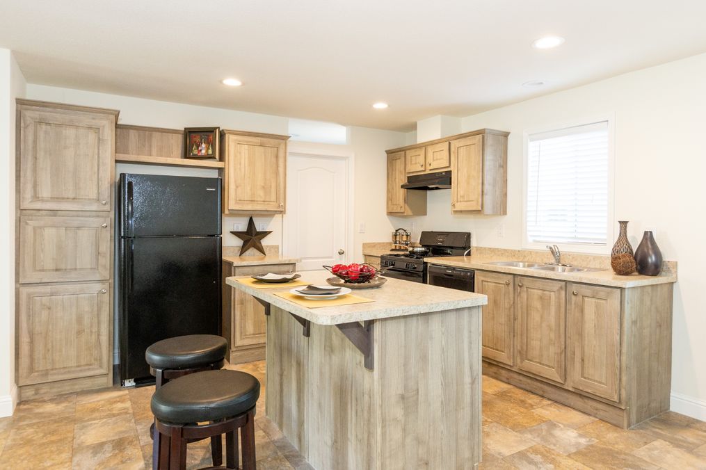 The FAIRPOINT 24463A Kitchen. This Manufactured Mobile Home features 3 bedrooms and 2 baths.