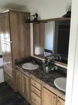 The 9593S         WASHINGTON Primary Bathroom. This Manufactured Mobile Home features 3 bedrooms and 3 baths.