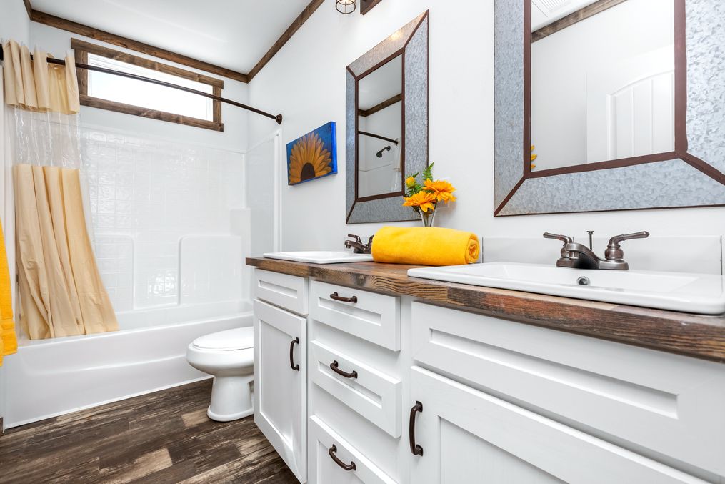 The THE BRAZOS Guest Bathroom. This Manufactured Mobile Home features 3 bedrooms and 2.5 baths.
