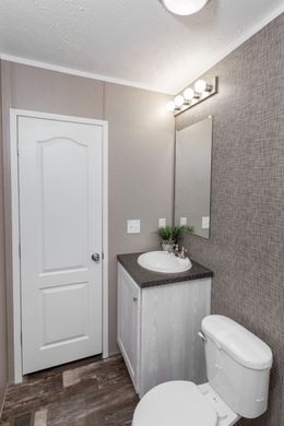 The THE ANNIVERSARY PLUS Master Bathroom. This Manufactured Mobile Home features 3 bedrooms and 2 baths.