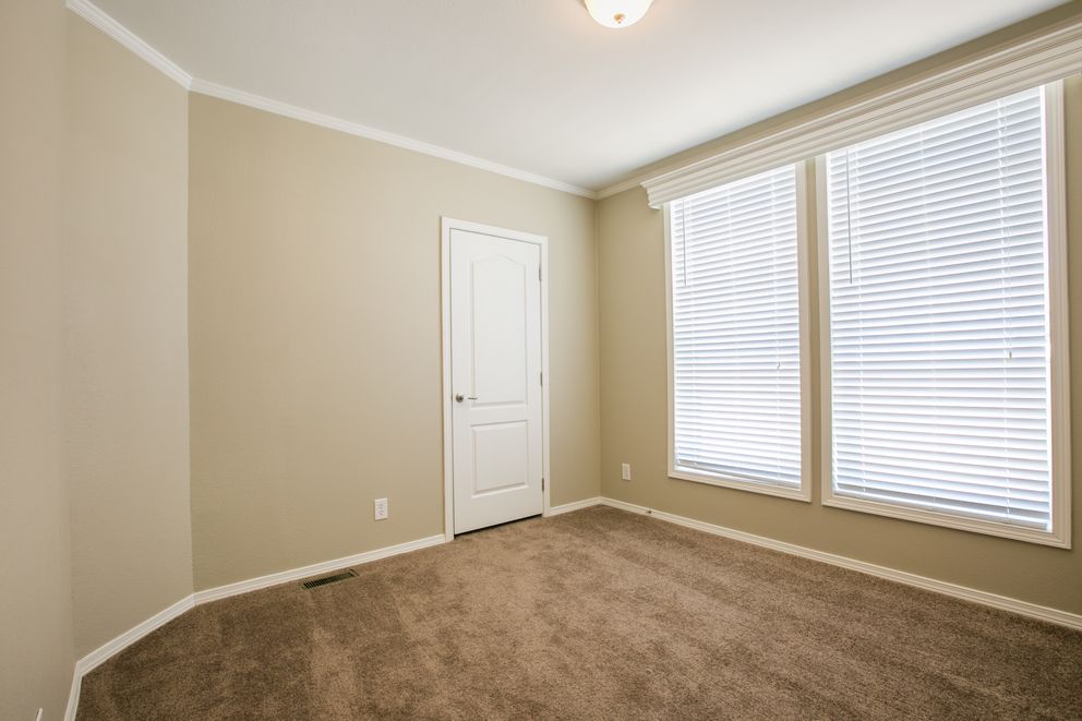 The TRANQUILITY TR3062A Bedroom. This Manufactured Mobile Home features 3 bedrooms and 2 baths.