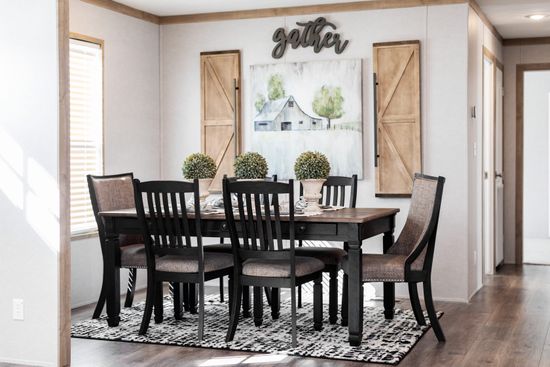 The FARM HOUSE BREEZE 56 Dining Area. This Manufactured Mobile Home features 3 bedrooms and 2 baths.
