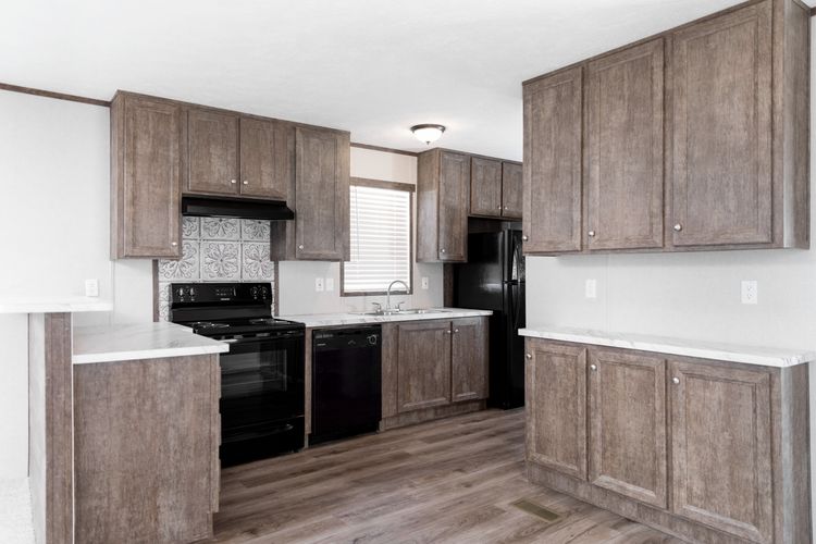 The BLAZER 66 B Kitchen. This Manufactured Mobile Home features 3 bedrooms and 2 baths.