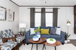 The THE REFLECTIONS Living Room. This Manufactured Mobile Home features 3 bedrooms and 2 baths.