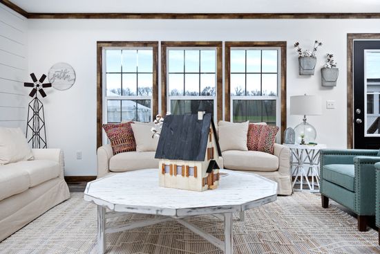 The THE LIZA JANE Living Room. This Manufactured Mobile Home features 3 bedrooms and 2 baths.