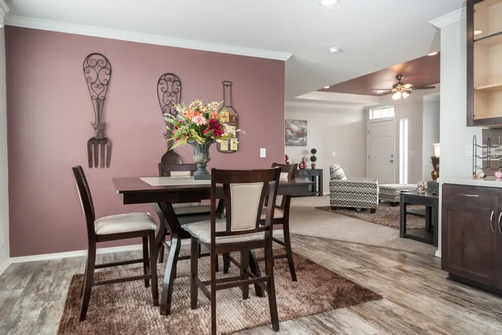 The ENCHANTMENT 3070A Dining Area. This Manufactured Mobile Home features 3 bedrooms and 2 baths.