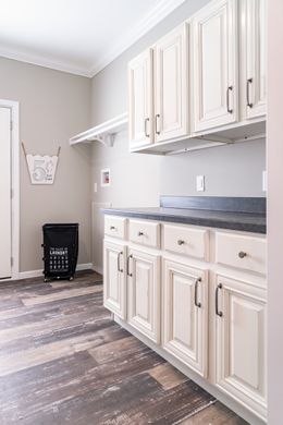 The THE TEAGAN Utility Room. This Manufactured Mobile Home features 4 bedrooms and 3 baths.