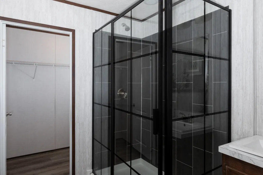 The THE REFLECTIONS Primary Bathroom. This Manufactured Mobile Home features 3 bedrooms and 2 baths.