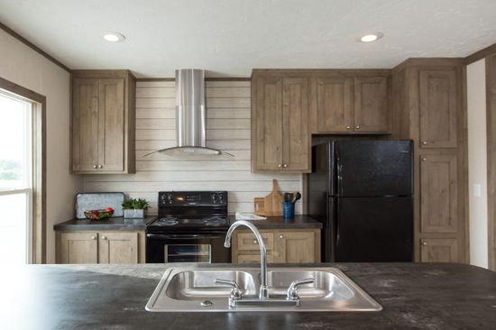 The THE NEW BREEZE II Kitchen. This Manufactured Mobile Home features 4 bedrooms and 2 baths.