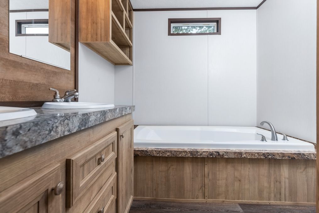 The THE ANNIVERSARY 16 Master Bathroom. This Manufactured Mobile Home features 3 bedrooms and 2 baths.